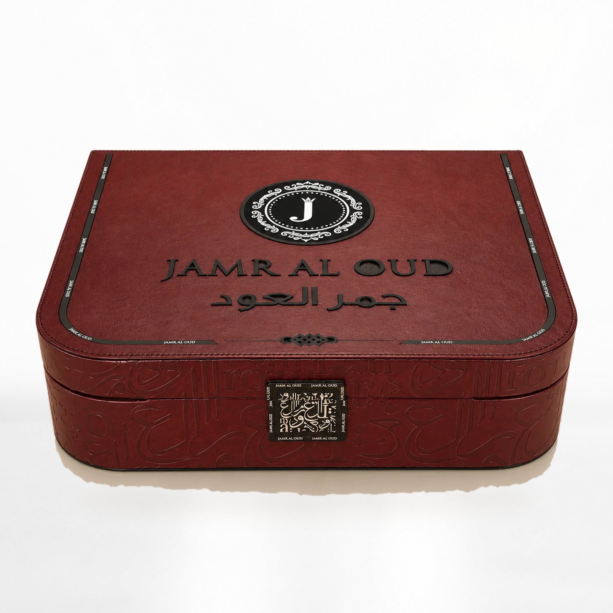 Al Mayas Selection Box: Closed burgundy leather trunk with gold corners, clasp and Jamr Al Oud emblem