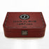 Al Mayas Selection Box: Closed burgundy leather trunk with gold corners, clasp and Jamr Al Oud emblem
