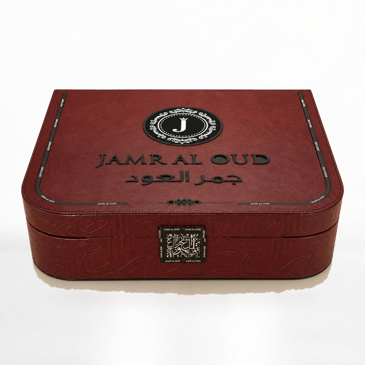 Al Mayas Selection Box: Closed burgundy leather trunk with gold corners, clasp and Jamr Al Oud emblem